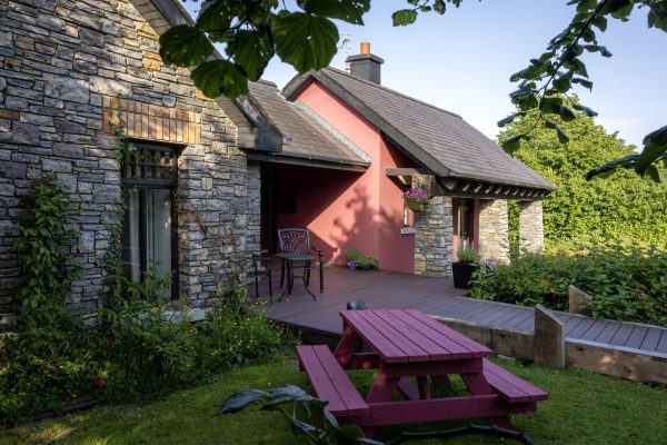 Picnic bench beside the lodge under the trees