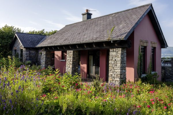 The front of the lodge with wildflower planting