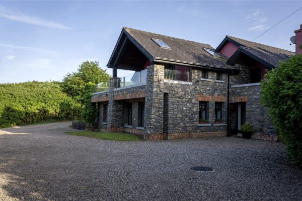 Gravel driveway and parking at the front of the lodge