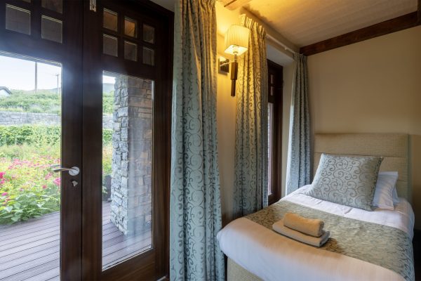 Bedroom with patio doors opening onto the garden